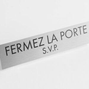 PLAQUETTE OPTIQUE INOX 180x40x1 mm "FERMEZ LA PORTE"